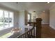 Foyer view of modern chandelier, staircase and large windows at 717 Penn Rd, Raleigh, NC 27604
