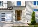 Inviting front entrance featuring a brick facade, arched entryway, and manicured landscaping at 717 Penn Rd, Raleigh, NC 27604