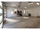 Clean, empty two-car garage with windows and two entry doors at 717 Penn Rd, Raleigh, NC 27604
