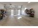 Spacious two-car garage with overhead lighting and storage shelves at 717 Penn Rd, Raleigh, NC 27604