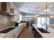 Modern kitchen with stainless steel appliances, custom cabinetry, and a large center island at 717 Penn Rd, Raleigh, NC 27604