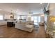 Spacious living room open to the kitchen with hardwood floors, fireplace, and access to the backyard at 717 Penn Rd, Raleigh, NC 27604