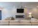 Cozy living room with a linear fireplace, modern lighting, and comfortable seating at 717 Penn Rd, Raleigh, NC 27604