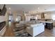 Bright open-concept living room flows into a modern kitchen with granite countertops and stainless steel appliances at 717 Penn Rd, Raleigh, NC 27604
