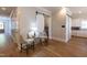 Inviting living room featuring hardwood floors and barn door leading to the kitchen at 717 Penn Rd, Raleigh, NC 27604