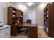 Office with wooden desk and storage cabinet, hardwood floors, and a bright window at 717 Penn Rd, Raleigh, NC 27604
