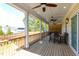Spacious covered porch with multiple ceiling fans and wooden floors at 717 Penn Rd, Raleigh, NC 27604