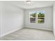Bright, carpeted bedroom with two windows providing plenty of natural light at 761 Portland Rose Dr, Knightdale, NC 27545