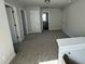 Upstairs bonus room with neutral carpet and view into the bathroom at 761 Portland Rose Dr, Knightdale, NC 27545