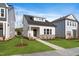 Charming single Gathering home featuring a manicured lawn and stone accents at 761 Portland Rose Dr, Knightdale, NC 27545