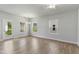 Bright living room with hardwood floors, neutral walls, natural light, and white trim at 761 Portland Rose Dr, Knightdale, NC 27545