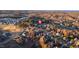 Overhead perspective of homes nestled around a serene lake, providing a sense of peaceful community living at 78 Rolling Meadows Ln, Chapel Hill, NC 27517
