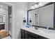 This bathroom features dark vanity, with and sinks, and a large mirror at 78 Rolling Meadows Ln, Chapel Hill, NC 27517