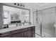 Beautiful bathroom features double vanity, large mirror, and glass shower at 78 Rolling Meadows Ln, Chapel Hill, NC 27517