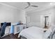 Bedroom featuring light gray walls, hardwood floors, modern ceiling fan, and trim at 78 Rolling Meadows Ln, Chapel Hill, NC 27517