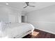 Spacious bedroom featuring light gray walls, hardwood floors, and a ceiling fan at 78 Rolling Meadows Ln, Chapel Hill, NC 27517