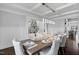 Lovely dining space with a decorative tree, modern lighting, and plenty of room for dinner guests at 78 Rolling Meadows Ln, Chapel Hill, NC 27517