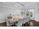 Sophisticated dining room with a long table, stylish chairs, and a decorative chandelier providing ample light at 78 Rolling Meadows Ln, Chapel Hill, NC 27517