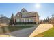 Well-maintained home featuring brick and stone design elements, lush lawn, and a paved driveway at 78 Rolling Meadows Ln, Chapel Hill, NC 27517