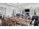 Bright open-concept area features a dining area, living room, fireplace and upscale furniture at 78 Rolling Meadows Ln, Chapel Hill, NC 27517