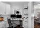 Small home office with granite countertops, dual monitors, office chair, and natural light at 78 Rolling Meadows Ln, Chapel Hill, NC 27517