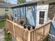 Cozy back deck with wooden railings, perfect for relaxing or entertaining at 908 Spruce St, Durham, NC 27701