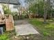 The backyard features a small deck, concrete patio and large, level yard perfect for entertaining at 908 Spruce St, Durham, NC 27701