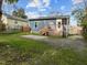 Enjoy the back of the home featuring a deck and concrete patio overlooking a large, level backyard at 908 Spruce St, Durham, NC 27701