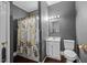 Cozy bathroom with standard tub, shower and vanity, perfect for a starter home at 908 Spruce St, Durham, NC 27701