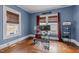 Room with natural light and hardwood floors, currently used as an office space at 908 Spruce St, Durham, NC 27701