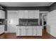 Functional kitchen features white cabinets, an undermount sink, and grey walls at 908 Spruce St, Durham, NC 27701