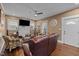 Cozy living room featuring hardwood floors, fireplace, and abundant natural light at 908 Spruce St, Durham, NC 27701