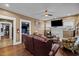 Comfortable living room with hardwood floors, a ceiling fan, and neutral decor at 908 Spruce St, Durham, NC 27701