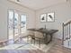 Dining room with modern table, stylish chairs, and a view of the back yard at 1173 Abbott St, Mebane, NC 27302