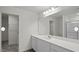 Modern bathroom with a large mirror, white vanity, and a shower-tub combination at 12 Rolling Banks Dr, Louisburg, NC 27549