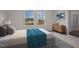 Serene bedroom with natural light, neutral decor, and a view of the outdoors at 12 Rolling Banks Dr, Louisburg, NC 27549