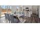 Elegant dining area with marble table, seating for eight, and natural light from sliding glass doors at 12 Rolling Banks Dr, Louisburg, NC 27549