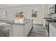 Modern kitchen with stainless steel appliances, granite countertops, and breakfast bar seating at 12 Rolling Banks Dr, Louisburg, NC 27549
