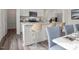 Modern kitchen with stainless steel appliances, granite countertops, and breakfast bar seating at 12 Rolling Banks Dr, Louisburg, NC 27549