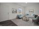 Bright living room featuring neutral walls, stylish decor, and comfortable seating arrangement at 12 Rolling Banks Dr, Louisburg, NC 27549