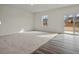 Spacious living area with new floors, ample natural light, and sliding glass door access to the backyard at 12 Rolling Banks Dr, Louisburg, NC 27549