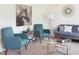 Cozy living room featuring stylish furniture, decor, and a large horse art piece at 12 Rolling Banks Dr, Louisburg, NC 27549