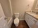 A bathroom includes a toilet, a tub, and a vanity with a granite countertop at 120 Keith Ct, Willow Springs, NC 27592