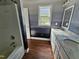 Bathroom featuring colorful countertop, painted walls, and a combination shower and tub at 120 Keith Ct, Willow Springs, NC 27592