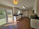 Updated kitchen with white cabinets, dark countertops, and sliding glass doors to the deck at 120 Keith Ct, Willow Springs, NC 27592
