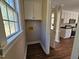 Practical laundry room with cabinet space and hookups, located adjacent to the kitchen at 120 Keith Ct, Willow Springs, NC 27592