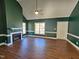 Bright living room with hardwood floors, fireplace and neutral paint at 120 Keith Ct, Willow Springs, NC 27592