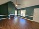 Spacious living room with a fireplace, hardwood floors and high ceilings at 120 Keith Ct, Willow Springs, NC 27592
