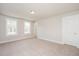 Spacious bedroom with carpet, neutral walls, trim, a ceiling light, and two windows providing natural light at 123 Weavers Grove Dr, Chapel Hill, NC 27514