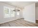 Dining area featuring wood floors, recessed lighting, a modern chandelier, and windows with a view at 123 Weavers Grove Dr, Chapel Hill, NC 27514